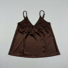 A dark brown sleeveless top with thin shoulder straps and a gathered drawstring waist